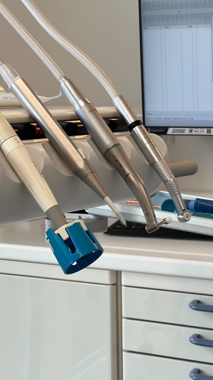 Dental tools neatly arranged in a dentists office, ideal for healthcare or medical settings.